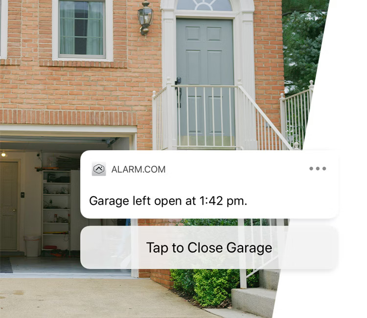 A brick house with an open garage, accompanied by an Alarm.com notification offering a quick option to close the garage remotely for convenience and security.