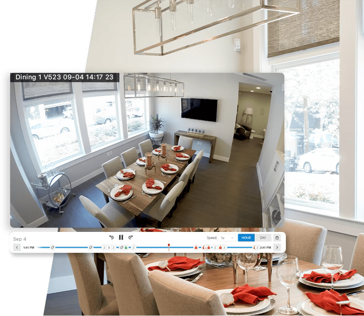A stylish dining area captured by Alarm.com’s indoor security camera with a timeline interface for reviewing recorded footage.